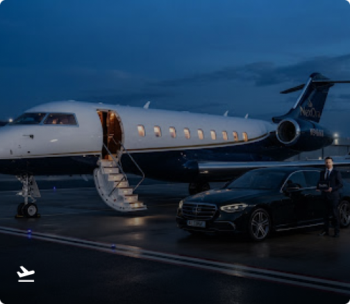Couple arriving on a red carpet at a gala beside a NexOra chauffeur car